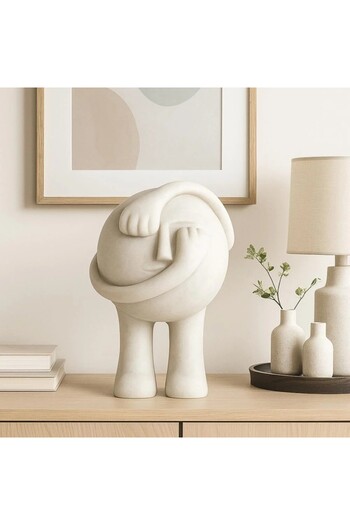 Vi Markets A modern decorative sculpture in white with a distinctive artistic touch.