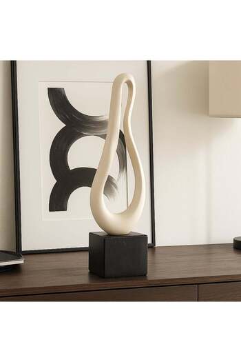 Vi Markets Modern decorative sculpture on a sleek black base.