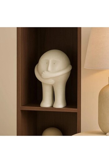 Vi Markets A modern decorative sculpture in white with a distinctive artistic touch.