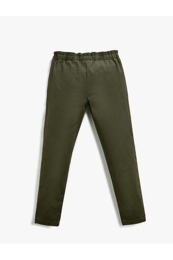 Koton Fabric Carrot Trousers with Button Detail and Pockets