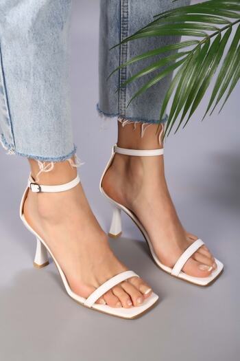 Shoeberry Women's Sesa White Skin Single Strap Heeled Shoes