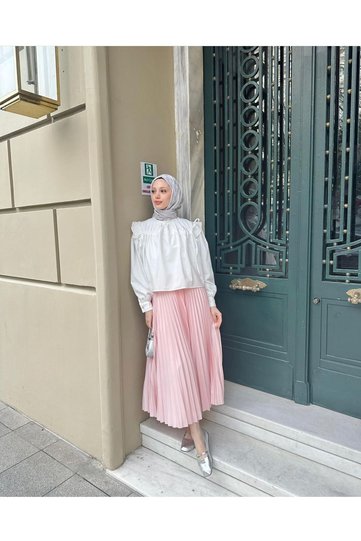 PLEATED TESETURINE SKIRT