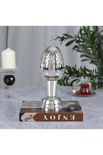 A luxurious hospitality incense burner made of elegant and modern stainless steel in silver.