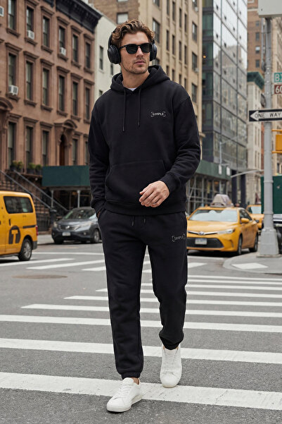 Trendyol Collection Set aus schwarzem Oversize-Sweatshirt und Jogginghose mit Kapuze und Stickerei – TMNAW24EM00000