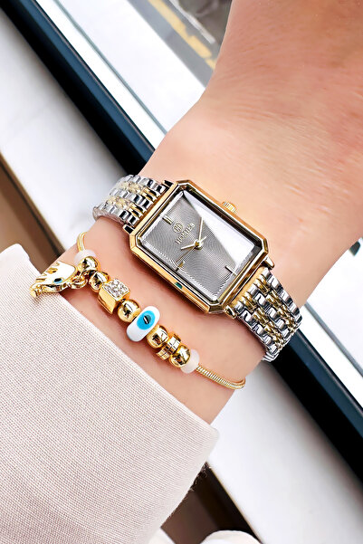 Homies ساعة يد نسائية خاصة مع علبة مقاومة للماء باللون الذهبي والفضي وسوار فو...