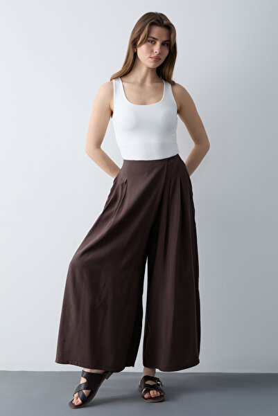 Trendyol Collection Smeđe široke modalne hlače sa dugmićima u stilu suknje TW...