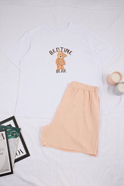 Trendyol Curve Σετ πιτζάμες σε μπεζ χρώμα με στάμπα αρκουδάκι και καρό σχέδιο...