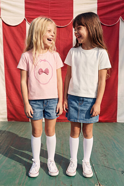 TRENDYOLKIDS تي شيرت محبوك مطبوع عليه فيونكة وردية-إكرو للفتيات من قطعتين TKD...