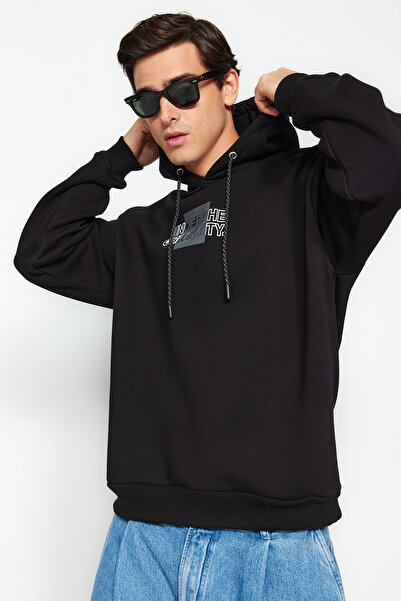 Trendyol Collection Μαύρο 100% βαμβάκι Oversize/Φαρδιά κουκούλα με μακρυμάνικο πίσω γράμμα εμπριμέ φούτερ TMNAW24SW00220