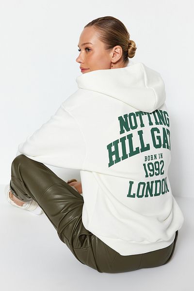 Trendyol Collection Ecru zadní potištěná mikina na zip s kapucí silná vnitřní fleece oversize fit pletená mikina TWOAW24SW00391