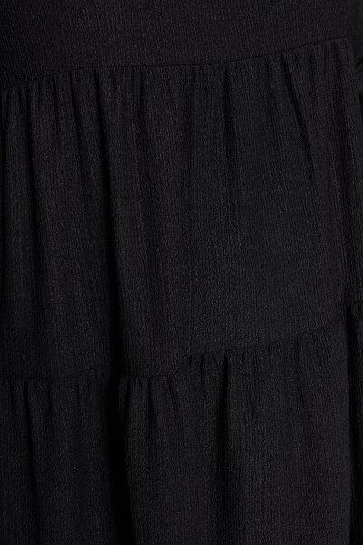 Trendyol Curve Černé minišaty A-Line s volánem větší velikosti - Tbbaw24Ah00041