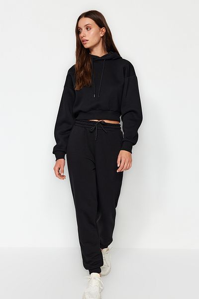Trendyol Collection Černé volné Jogger Regular Waist Silné pletené tepláky Kalhoty TWOAW24EA00029
