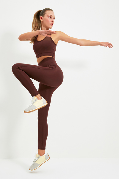 Trendyol Collection Ciemnobrązowe legginsy sportowe z dzianiny, z szeroką talią i dodatkowym odzyskiem, pełnej długości TWOAW21TA0029