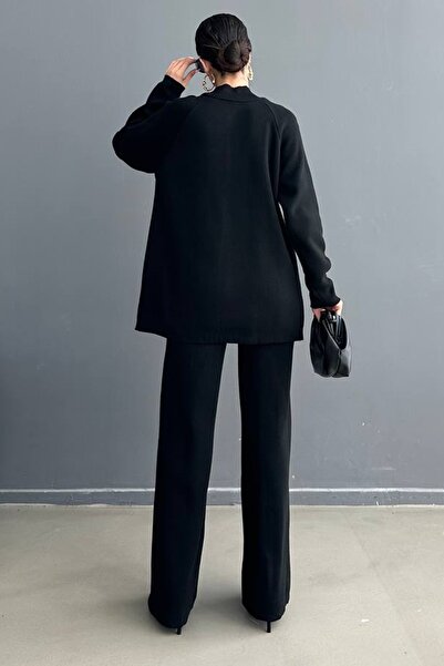 vuvutasarım Πλεκτό ύφασμα ψηλό γιακά Μαύρο πουλόβερ και ψηλόμεσο μαύρο παντελόνι στο κάτω μέρος Πλεκτό κοστούμι 1070