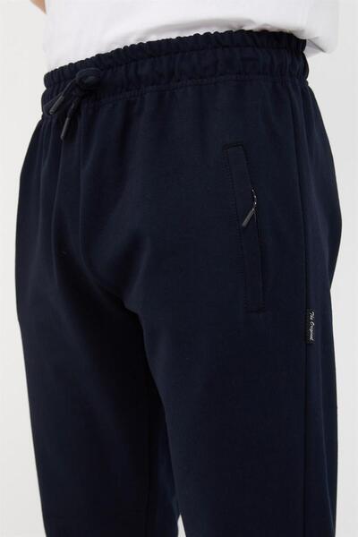 mmetalic Чоловічі темно-сині спортивні штани - з резинкою на штанинах і кишенями на блискавці