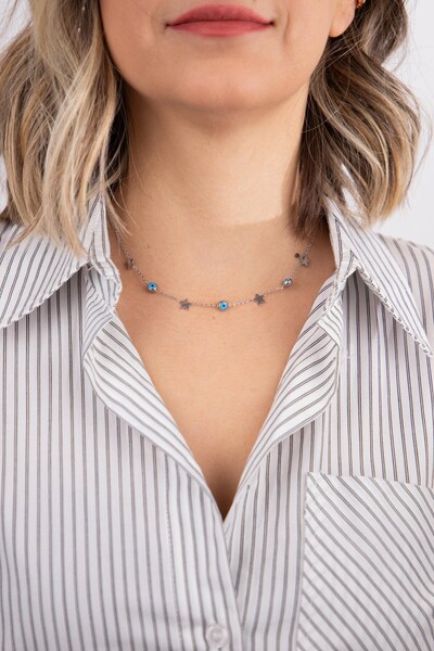 Sacha Accessories قلادة من الفولاذ الفضي - صف من النجوم والعين الشريرة