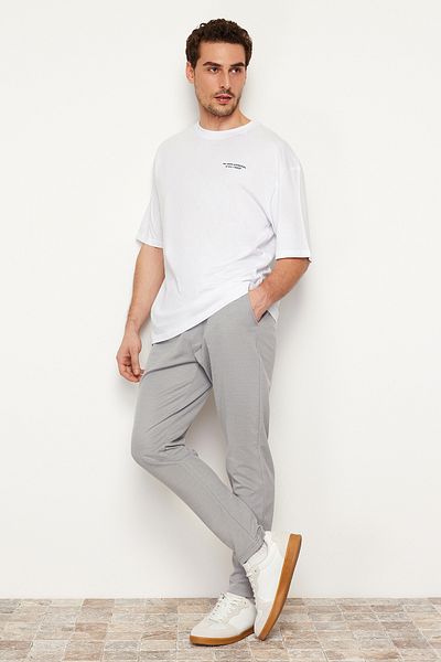 Trendyol Collection Γκρι Jogger Fit Ελαστική γραβάτα μέσης με υφή πλεκτό άνετο παντελόνι TMNSS24PL00007
