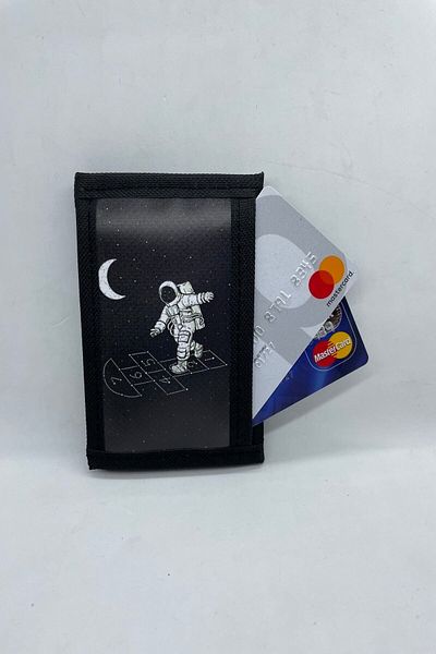 MENİSE Astronaut Playing Hopscotch on the Moon with Velcro