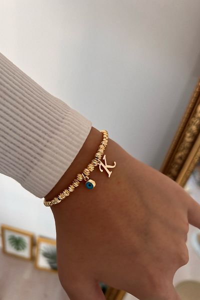 Trendy Butik سوار دوريكا بحرف K وعين الشر المتدلية