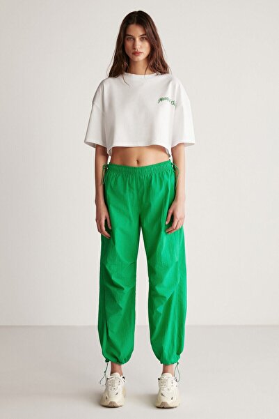 GRIMELANGE Kelsey Women's Waterproof Parachute Fabric Green Trousers with Stopper Detail