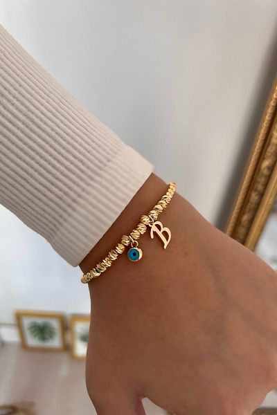 Trendy Butik سوار دوريكا مع حرف B وعين الشر المتدلية