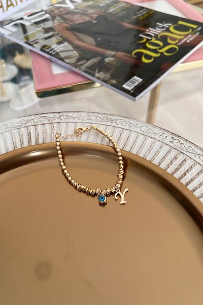 Trendy Butik سوار دوريكا بحرف Y وعين الشر المتدلية