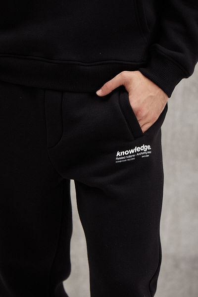 GRIMELANGE Weiche, elastische, schmale Herren-Jogginghose von Bernon mit drei Taschen aus Bio-Baumwolle in Schwarz