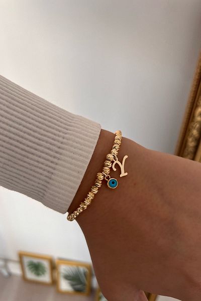 Trendy Butik سوار دوريكا بحرف Y وعين الشر المتدلية
