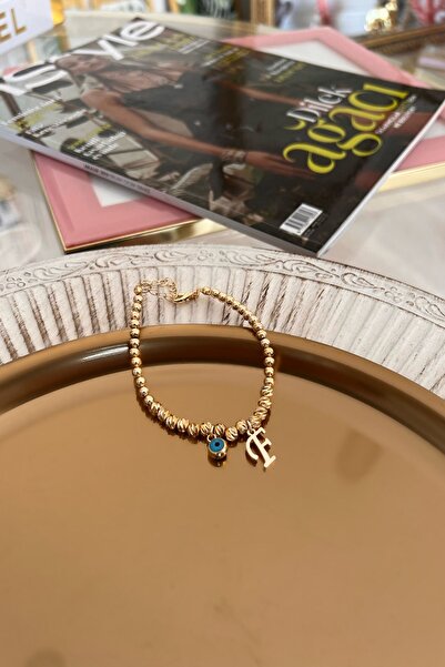 Trendy Butik سوار دوريكا مع حرف F وعين الشر المتدلية