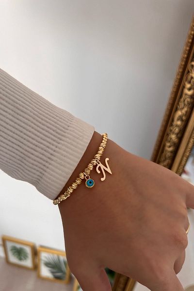 Trendy Butik سوار دوريكا مع حرف N وعين الشر المتدلية