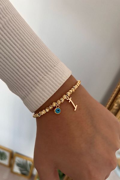 Trendy Butik سوار دوريكا مع حرف I وعين الشر المتدلية