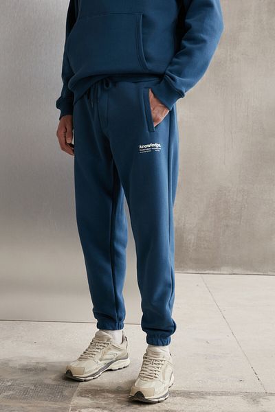 GRIMELANGE Weiche, elastische, schmale Herren-Jogginghose von Bernon mit drei Taschen aus Bio-Baumwolle in Blau