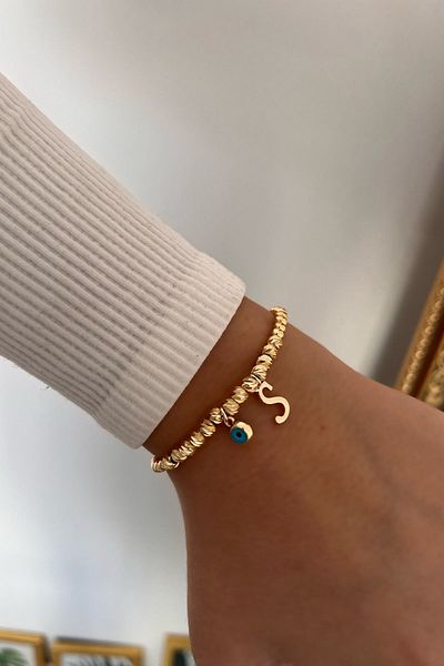 Trendy Butik سوار دوريكا مع حرف S وعين الشر المتدلية