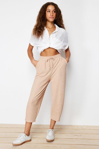 Trendyol Collection Beige Textured Wrapped Carrot/Baggy Cut Knitted Trousers TWOSS24PL00098