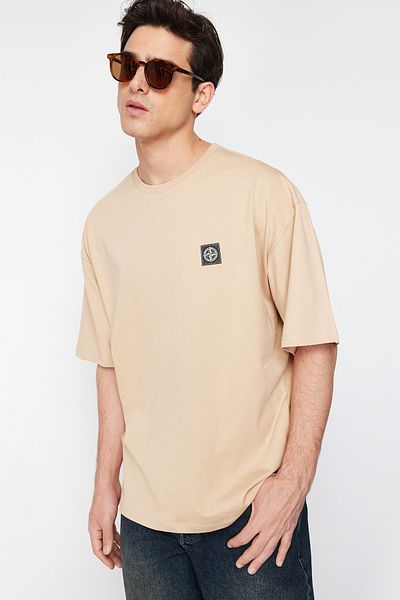 Trendyol Collection Béžové oversize tričko Tok Fabric Compass - 100% bavlna TMNSS24TS00111