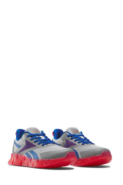 Reebok حذاء الجري ZIG N' GLOW المطاطي باللون الرمادي للأولاد