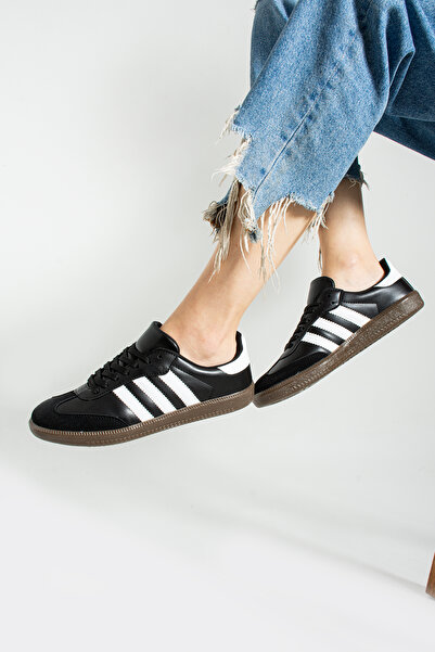 Wenti Shoes حذاء رياضي نسائي برباط باللونين الأبيض والأسود من Martin Daily