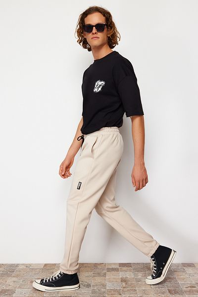 Trendyol Collection Beige Scuba Fabric - Labeled Regular Cut Sweatpants TMNSS24EA00002