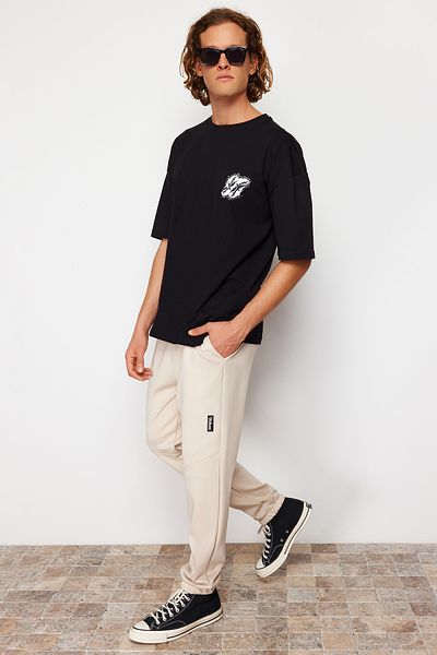 Trendyol Collection Beige Scuba Fabric - Labeled Regular Cut Sweatpants TMNSS24EA00002