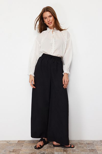Trendyol Modest بنطلون منسوج بتصميم أرجل واسعة باللون الأسود TCTSS22PL0240