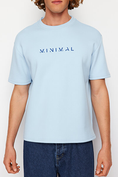 Trendyol Collection Υπερμεγέθη μπλε φουσκωτό μπλουζάκι - Τυπωμένο κείμενο, κοντό μανίκι, σκληρό ύφασμα - TMNSS24TS00114