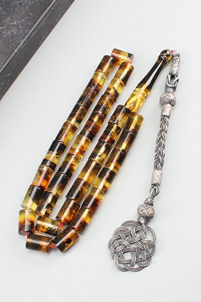 isfahantakı fosilli damla kehribar kesme gümüşlü 7.5x11 mm 28 gram