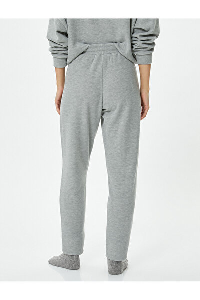 Koton Pyžamové kalhotky s krajkovým pasem zužující se nohavicí směs viskózy