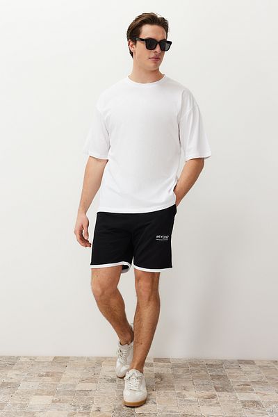 Trendyol Collection Weißes Oversize-T-Shirt aus Baumwolle mit Blumendruck - TMNSS21TS1223