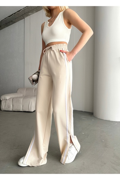 schlank Γυναικείο παντελόνι φόρμας με πέτρινες ρίγες, σκίσιμο και ψηλόμεσο, μ...