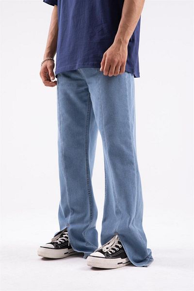 Flaw Wear الجينز الأزرق الجليدي الفضفاض مع تفاصيل الشق