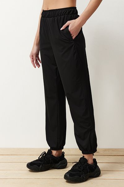 Trendyol Collection Black Leg Zipper Detailed Thin Knitted Sports Lycra Sweatpants THMSS24EA00002