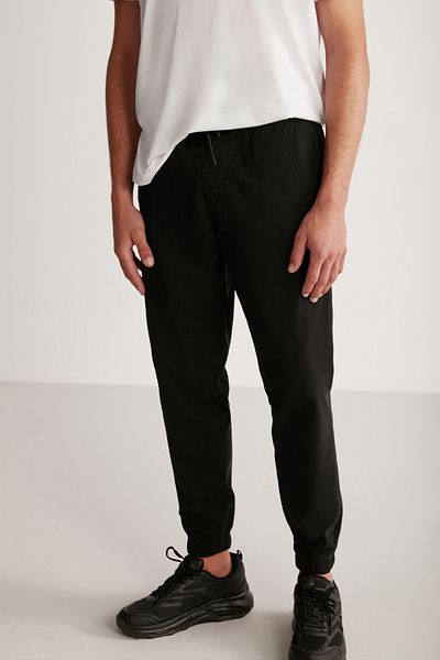 GRIMELANGE Jakob Men's Woven Washed 4-Pocket Thick Textured Black Trousers with Elastic Legs