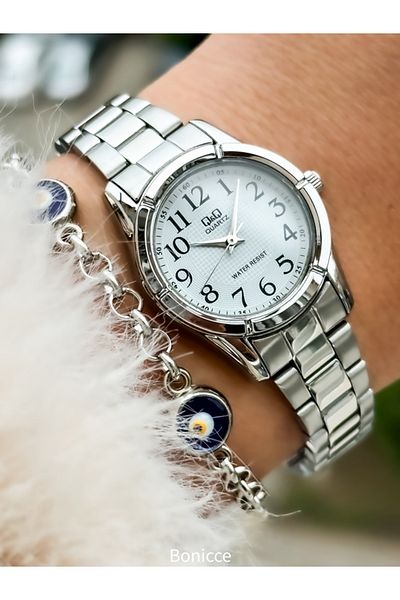 Q&Q Silver Colored Small Case - Steel Cord Evil Eye Beaded Bracelet Wristwatch