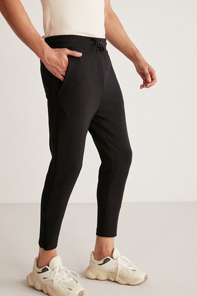 GRIMELANGE Schwarze Herren-Jogginghose aus technischem, dickem, flexiblem Stoff von Nıcolas mit schmaler Passform und Beinen mit Reißverschluss